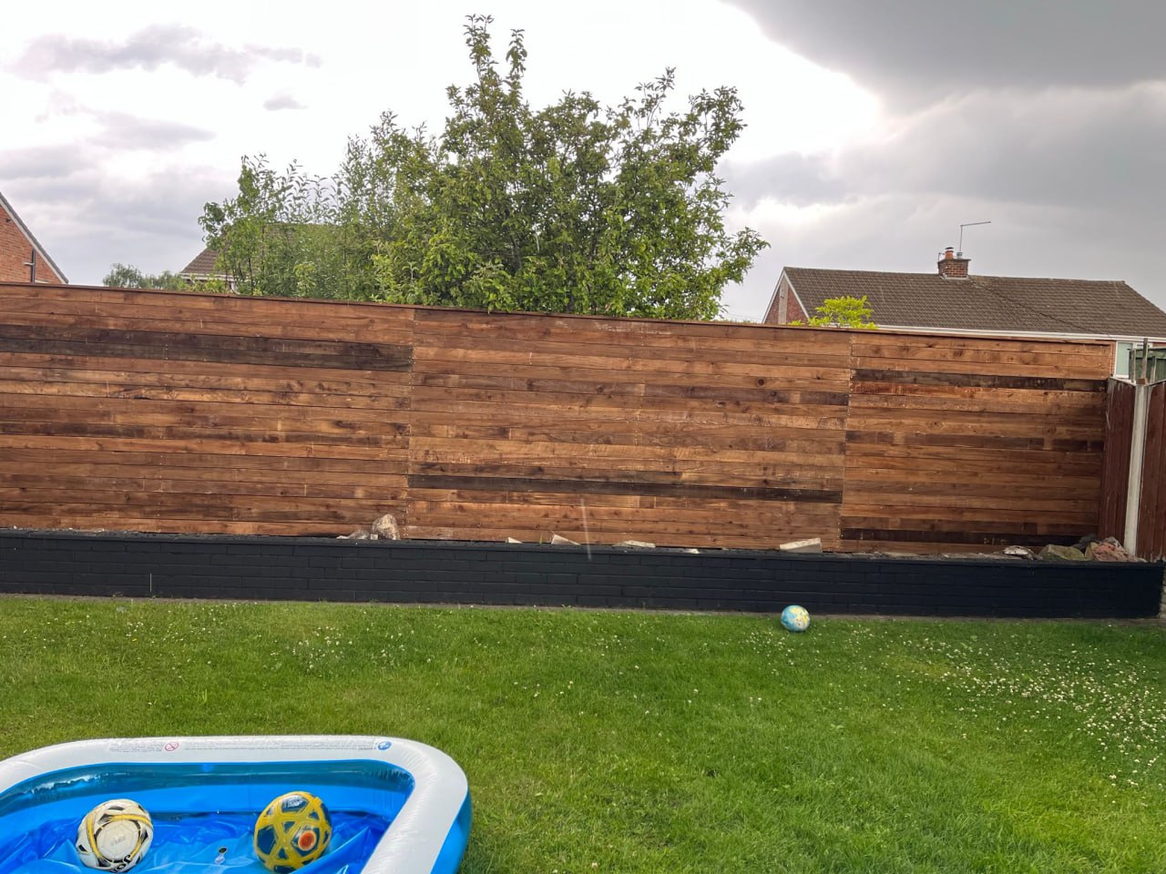Timber garden fence installation